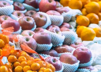 a display of apples, oranges, and other fruits