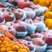 a display of apples, oranges, and other fruits