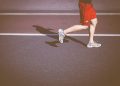 person running on concrete road