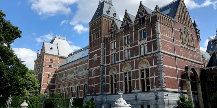 brown concrete building near green grass field during daytime