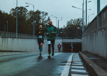 group of people running on street