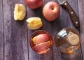 sliced apple beside black handled knife