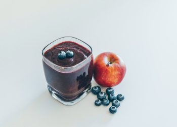 red apple on white surface
