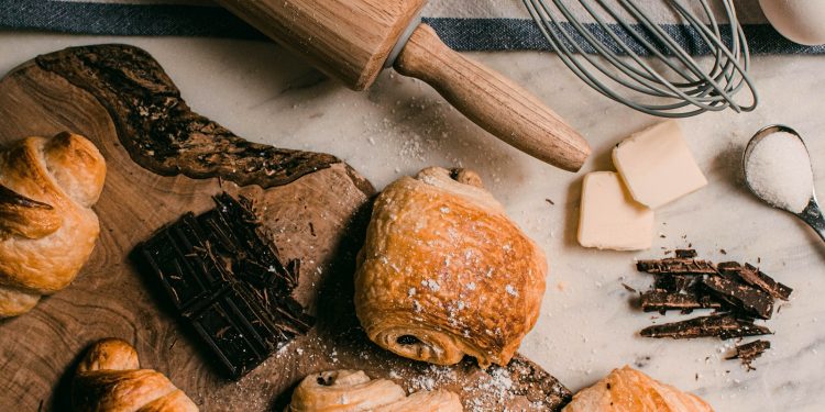 brown wooden rolling pin beside brown wooden rolling pin