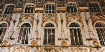 a large building with many windows and gold decorations