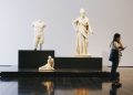 woman standing on woman wearing white dress statue