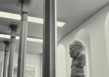 white concrete statue of man