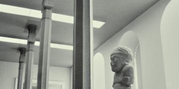 white concrete statue of man