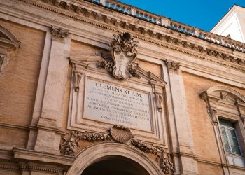 a large building with a clock on the front of it