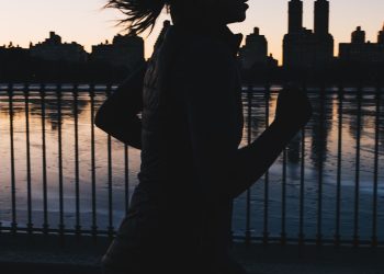 silhouette photo of woman running