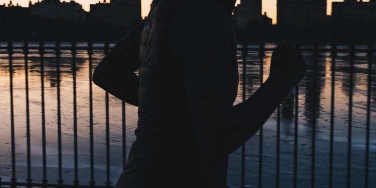 silhouette photo of woman running