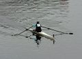 a person rowing a boat on a body of water