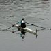 a person rowing a boat on a body of water