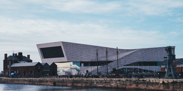 a large building next to a body of water