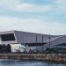 a large building next to a body of water