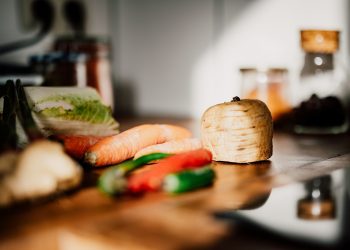 sliced vegetables on brown wooden chopping board