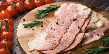 raw meat on brown wooden chopping board